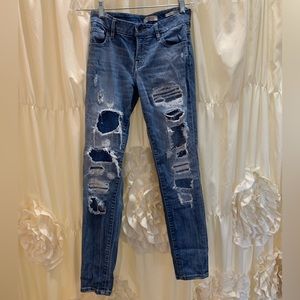 Guess Jeans distressed/ripped blue jean “power curvy mid style”. Womens size 25